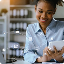 Woman in an office using a tablet, with digital financial and technology icons overlaid, indicating online or digital business activities.